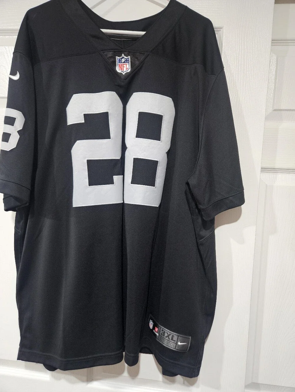 Nike Men’s Black Football Jersey with White 28 and Jacobs